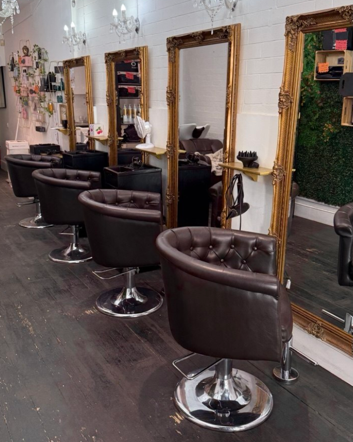 Quiff Salon interior in Headingley, Leeds with styling chairs, mirrors and chandeliers